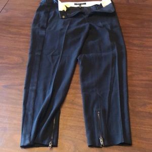 Black ankle zip trousers